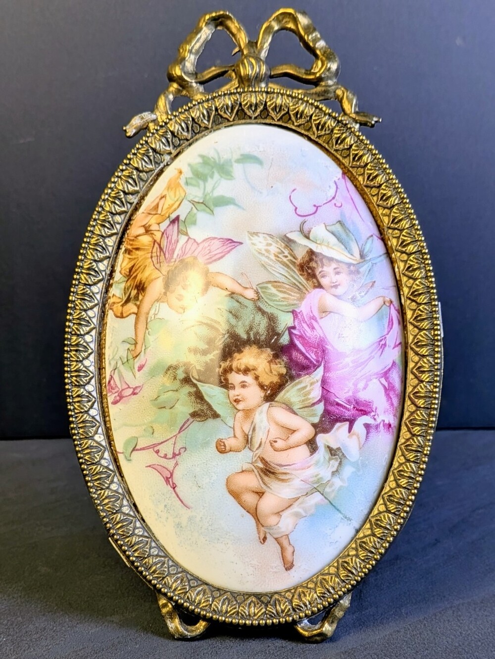 Vintage Italian Brass Bow Oval Frame With Porcelain Cherub Plaque